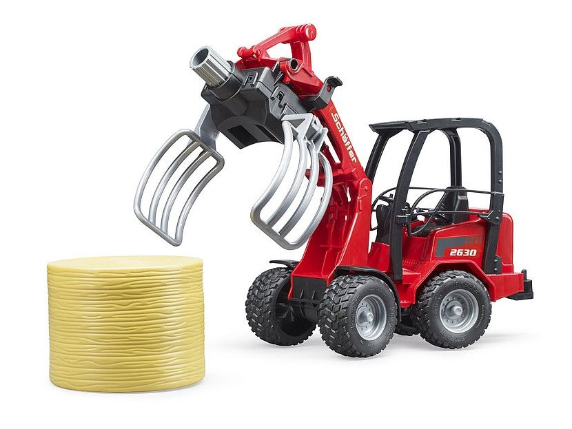 Schäffer Hoflader 2630 mit Ballengreifzange und 1 Rundballen