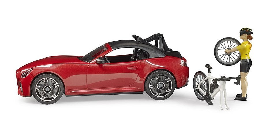 Bruder Roadster mit Rennrad und Radfahrerin