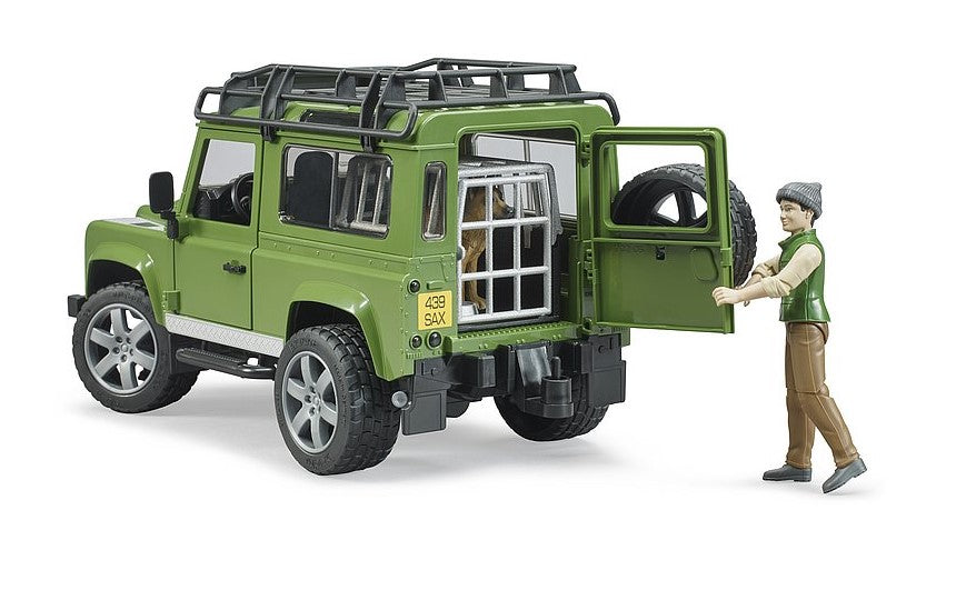 Land Rover Defender Station Wagon mit Förster und Hund