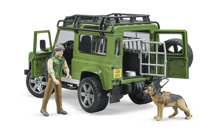 Land Rover Defender Station Wagon mit Förster und Hund